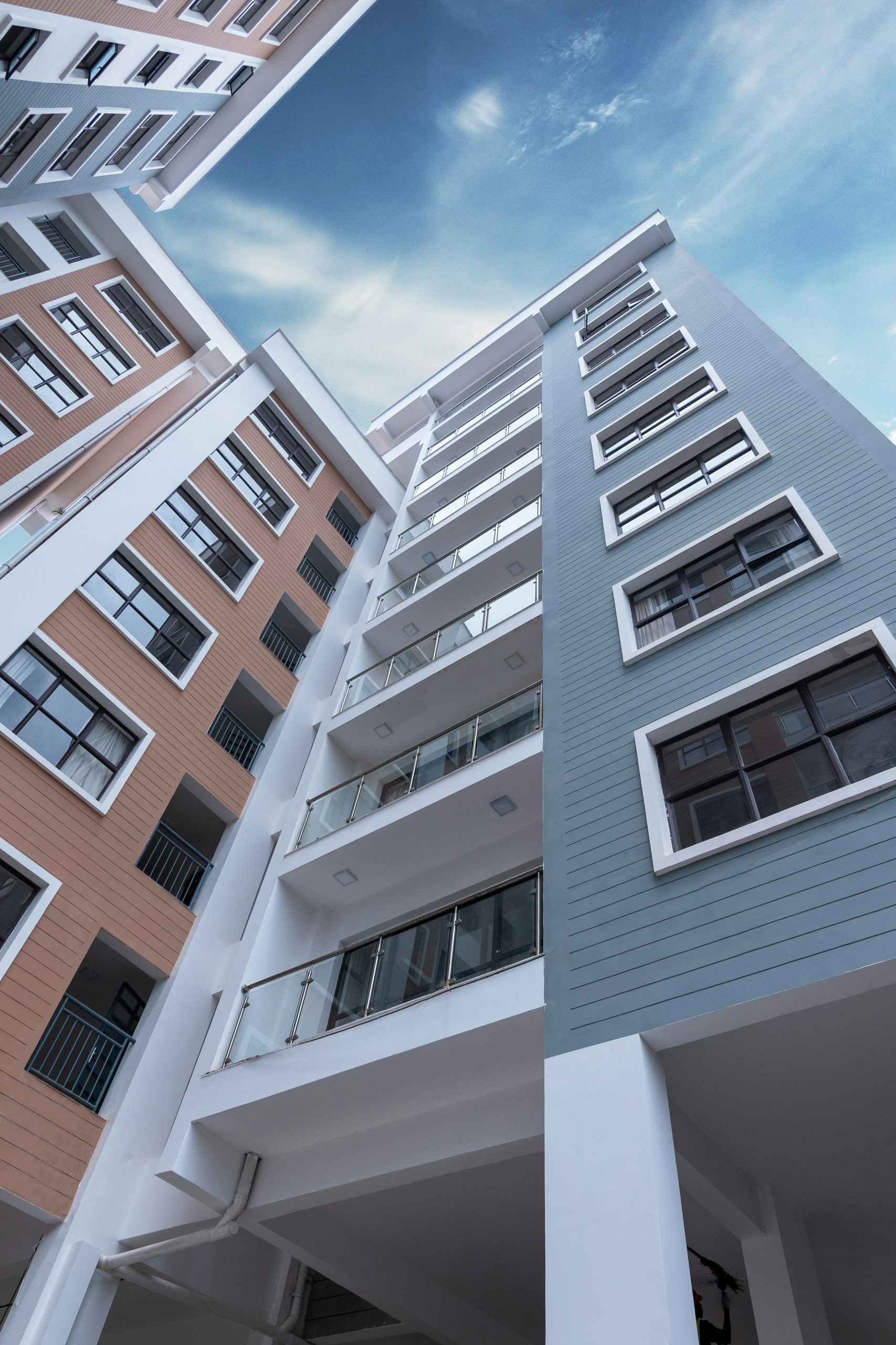 View of apartment buildings looking straight up into the sky